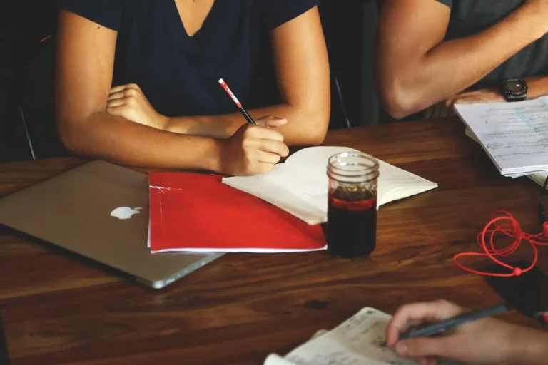 Pomodoro technique: people writing in notebooks during a focused work session