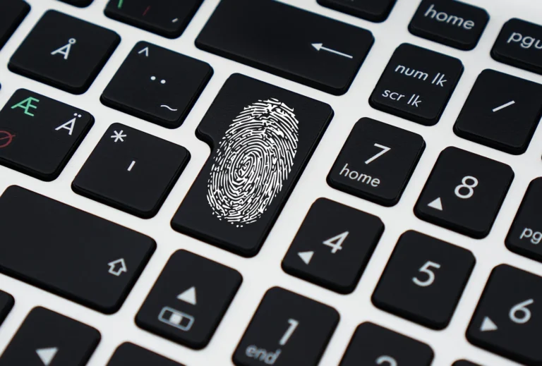 Strong passwords concept: fingerprint symbol on a laptop keyboard key