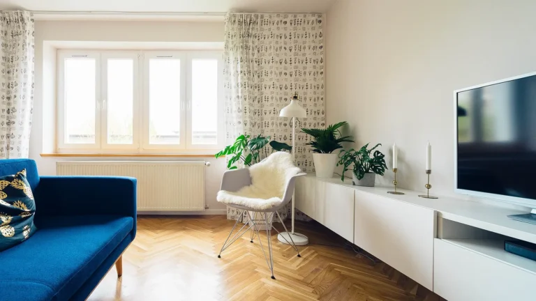 Bright, tidy living room showing how to declutter your home for a calmer space