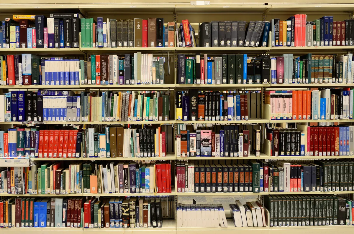 Library shelves full of colourful books to explore with a daily reading habit